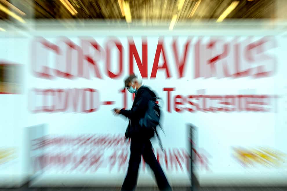 A man walks by a coronavirus testing centre in Frankfurt, Germany