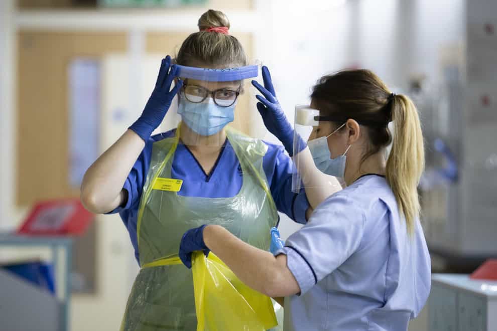 Nurses changing their PPE