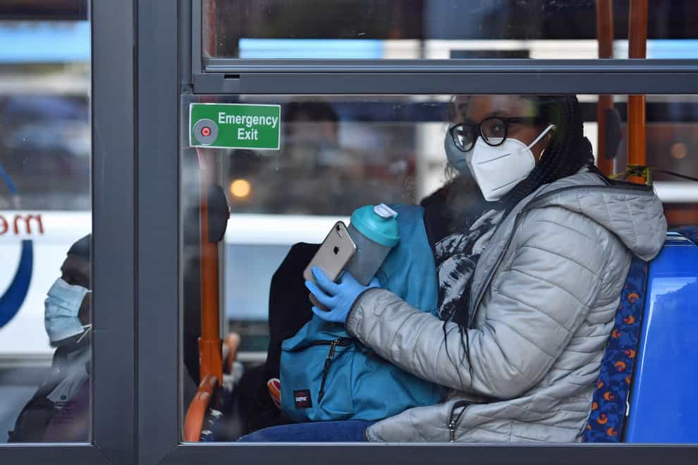 A bus passenger wearing a mask
