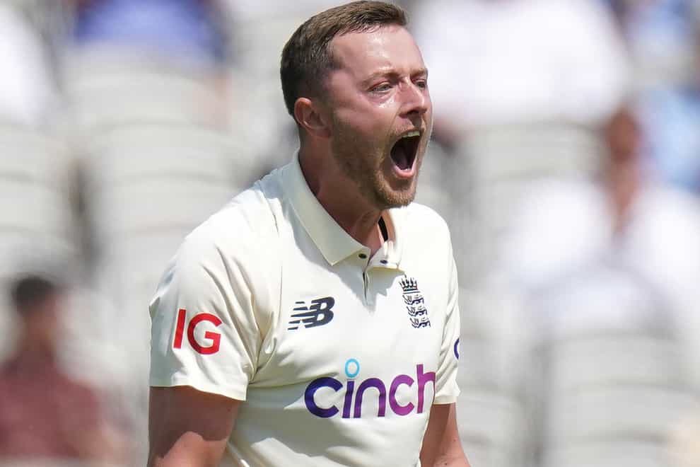 England’s Ollie Robinson celebrates taking the wicket of New Zealand’s Tom Latham