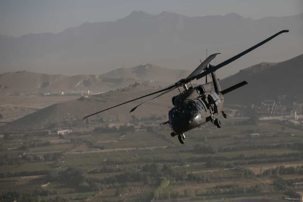 A Black Hawk helicopter over Kabul in Afghanistan (Dan Kitwood/AP)