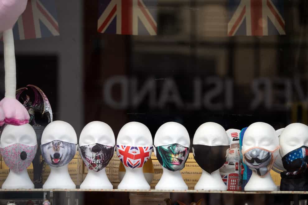 Face masks on display in a shop (Andrew Matthews/PA)