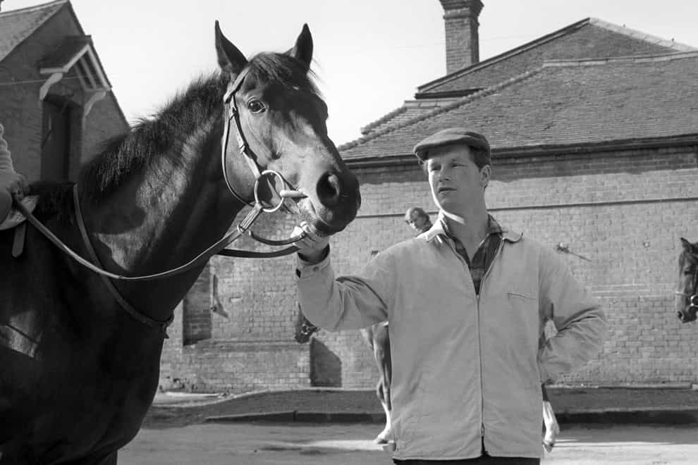 Mill Reef standing with Ian Balding in the build-up to the Derby