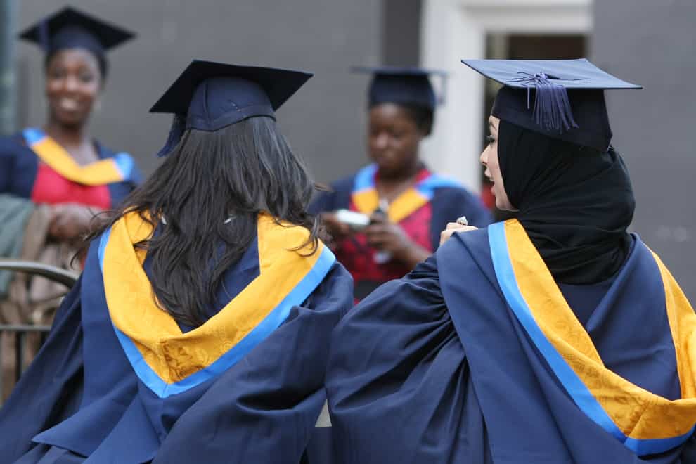 A general view of students wearing Mortar Boards and Gowns after graduating from Anglia Ruskin University in Cambridge