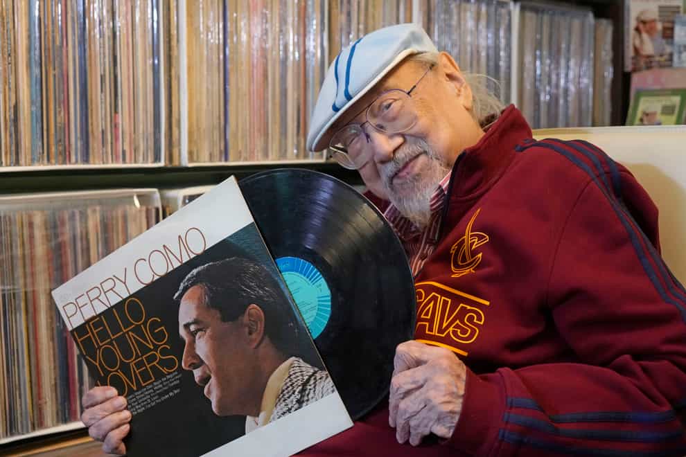Ray Cordeiro shows a vinyl record at his home in Hong Kong