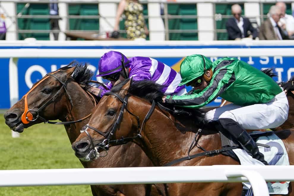 Oh This Is Us (left) gets up to win the Diomed Stakes at Epsom