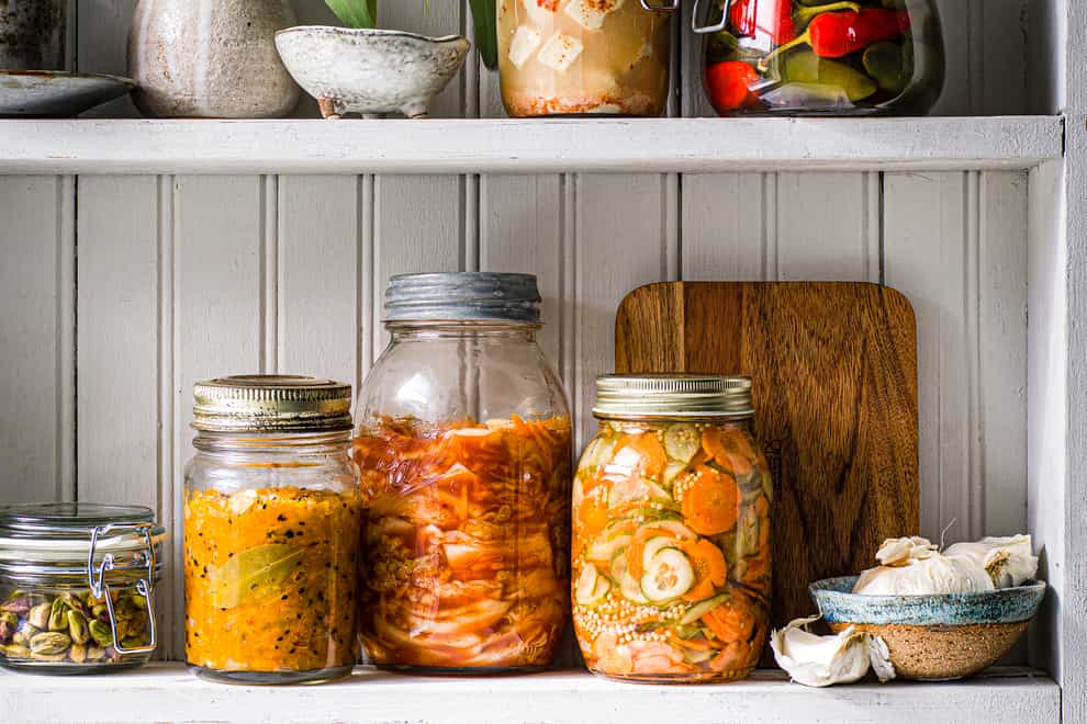 Tangy carrot chutney and other pickles on a shelf