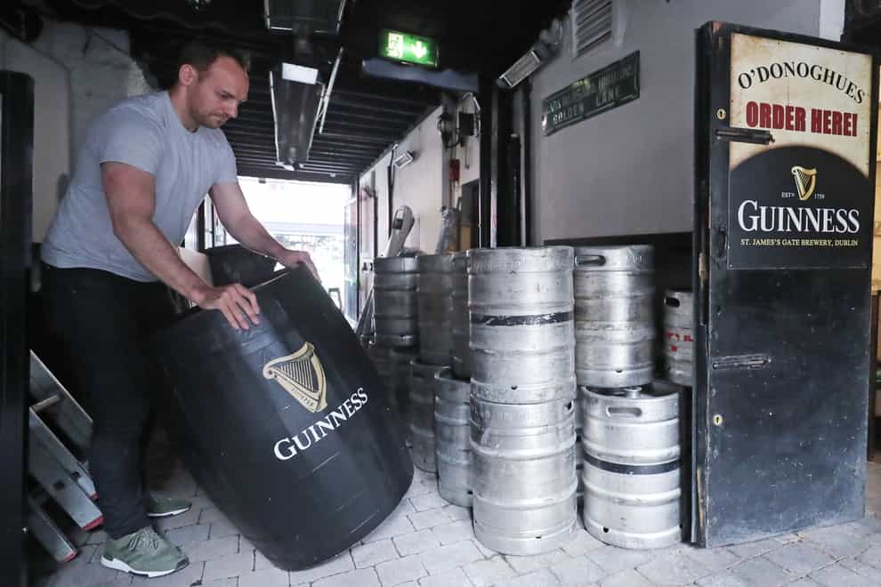 Kevin Barden sets up an outdoor drinking area at O'Donoghues Bar in Dublin