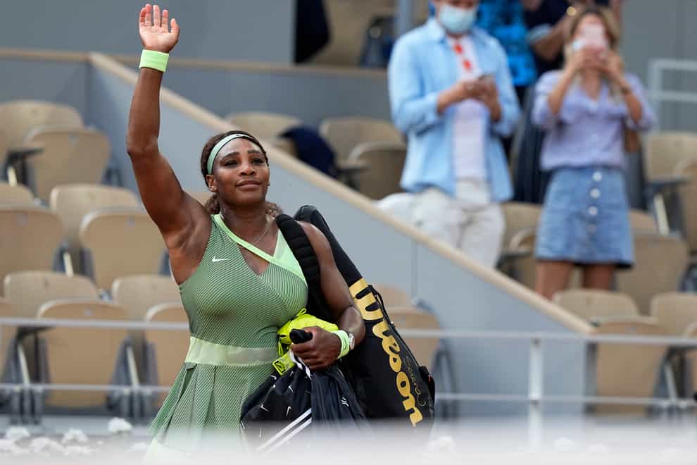 Serena Williams waves to the crowd following her loss to Elena Rybakina