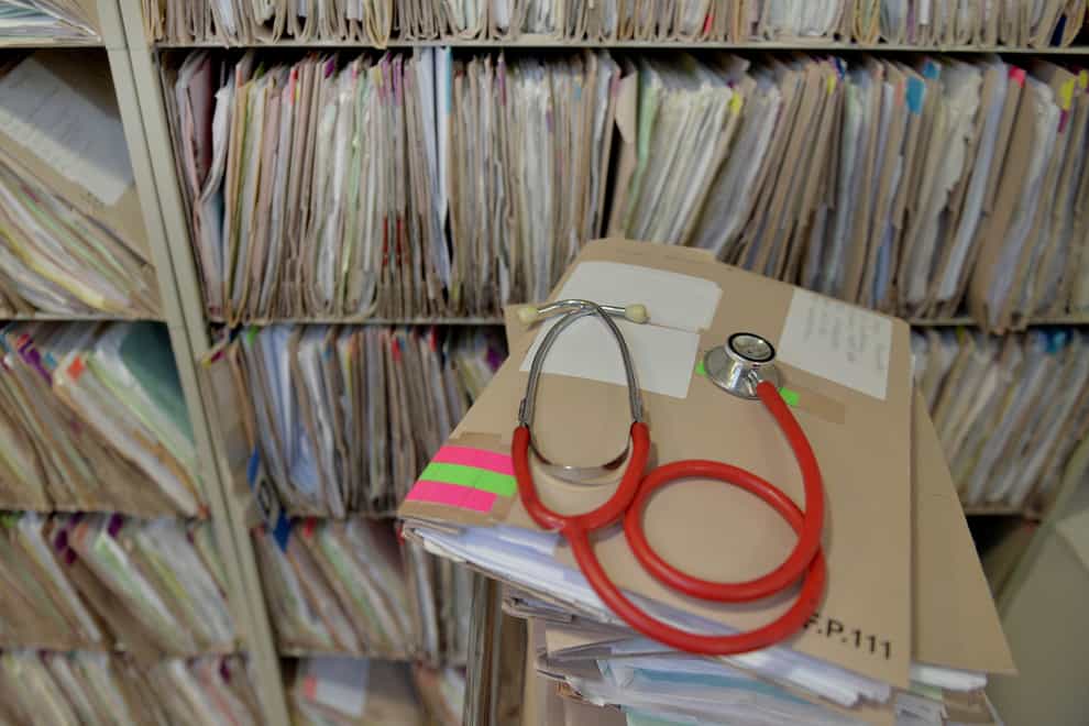 A stethoscope on top of patient’s files