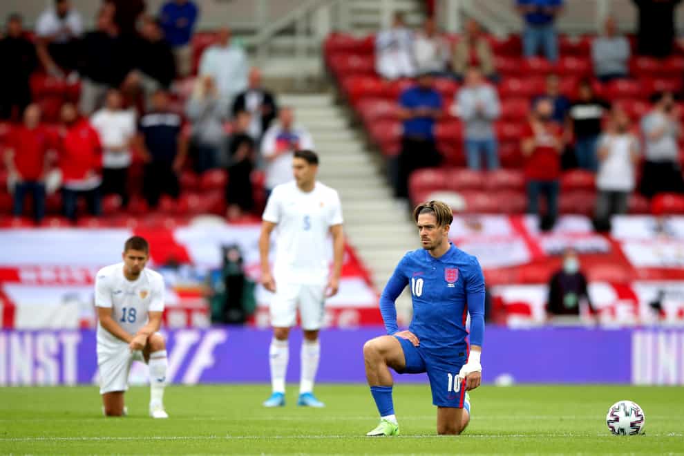 England’s Jack Grealish takes a knee before their European Championship warm-up match with Romania at Riverside Stadium