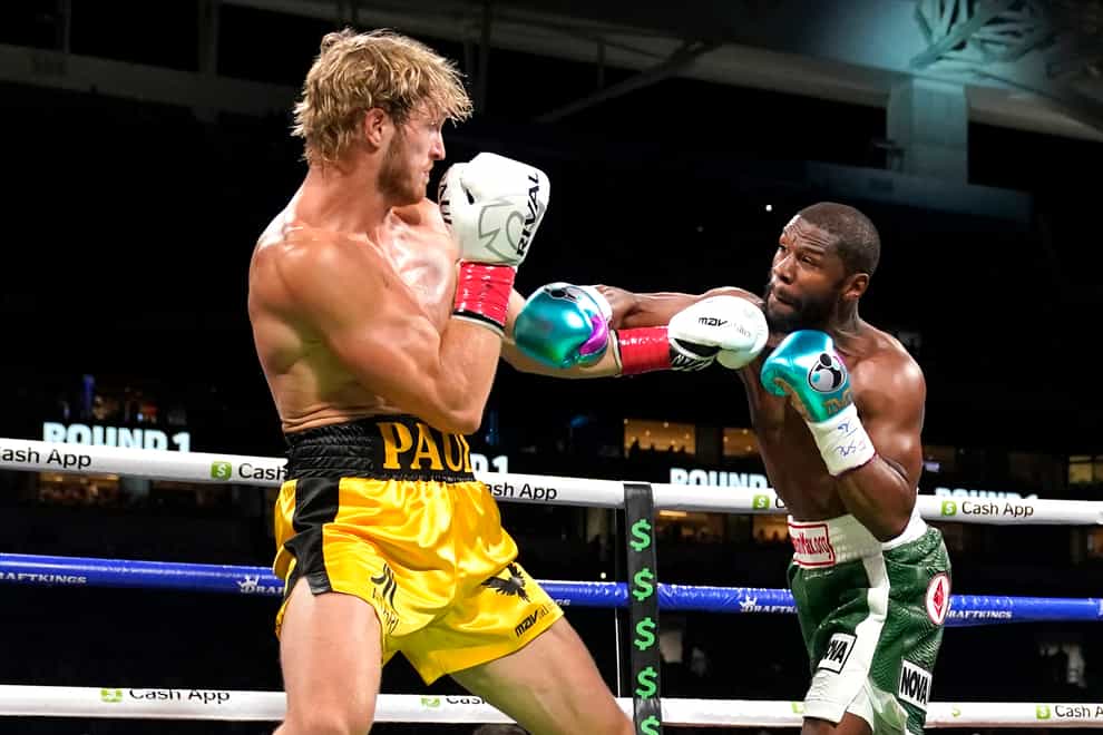 Logan Paul and Floyd Mayweather in action