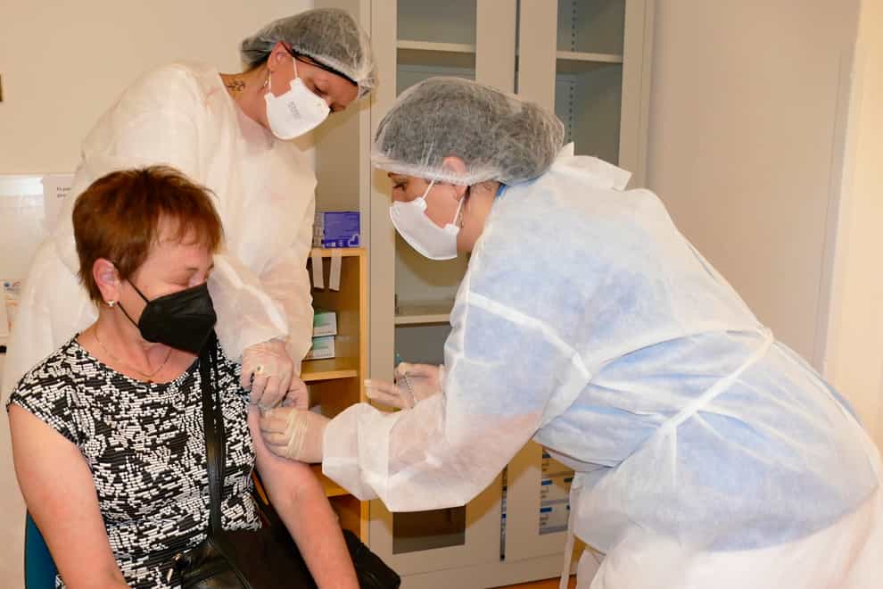 A woman is administered the Sputnik V Covid-19 vaccine in Zilina, Slovakia (Erika Durcova/AP)