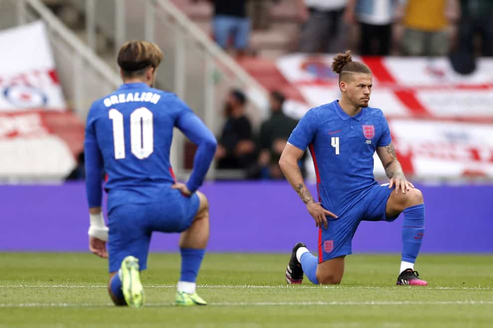 England's Jack Grealish and Kalvin Phillips take the knee before the international friendly against Romania