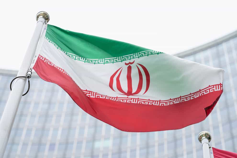The flag of Iran waves in front of the the International Centre building with the headquarters of the International Atomic Energy Agency, IAEA, in Vienna, Austria (Florian Schroetter/AP)