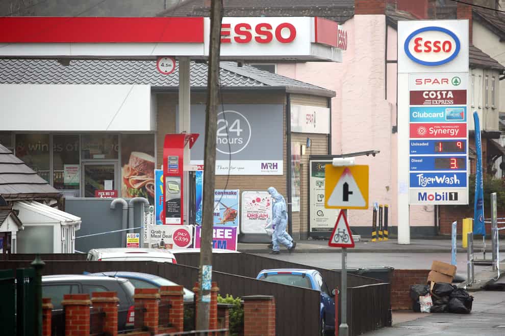 Forensic officers at the Esso petrol station in Romford following the incident