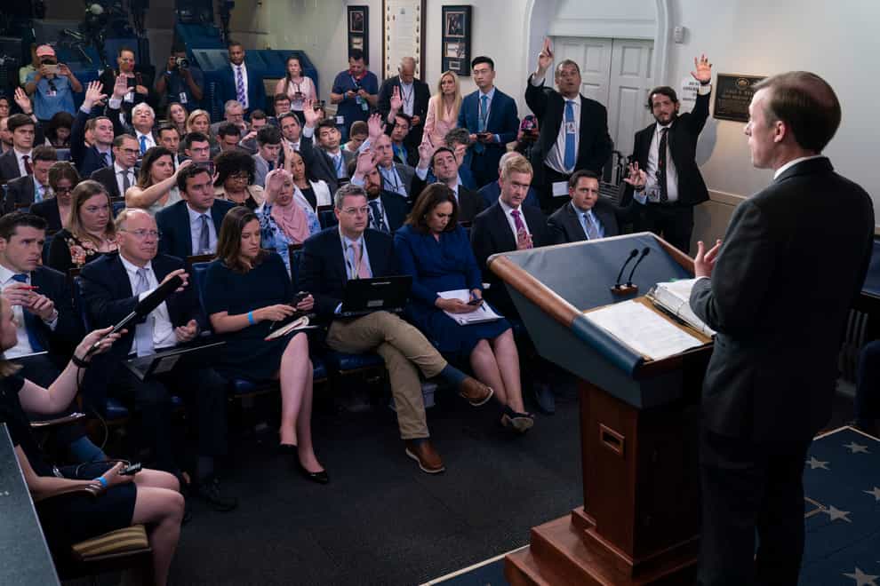 <p>Journalists raise their hands to ask a question in the White House (Evan Vucci/AP)</p>
