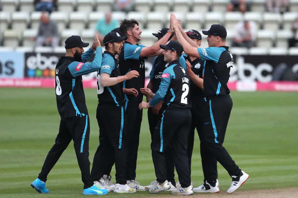Worcestershire Rapids’ Josh Tongue (centre) and team-mates celebrate taking the wicket of Notts Outlaws’ Peter Trego resulting in a tie game during the Vitality T20 Blast match at the New Road