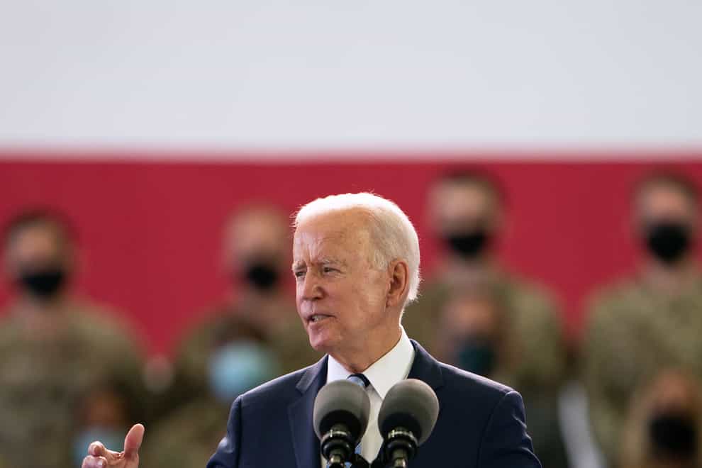 US President Joe Biden addresses US military personnel at RAF Mildenhall in Suffolk
