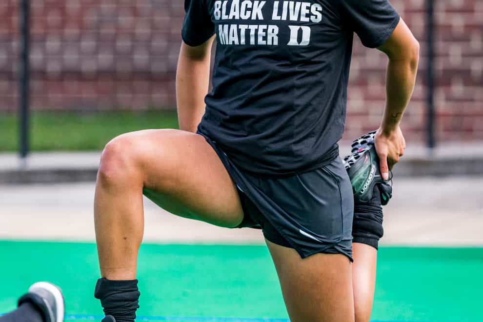England Under-21 hockey player Darcy Bourne takes the knee wearing a Black Lives Matter T-shirt