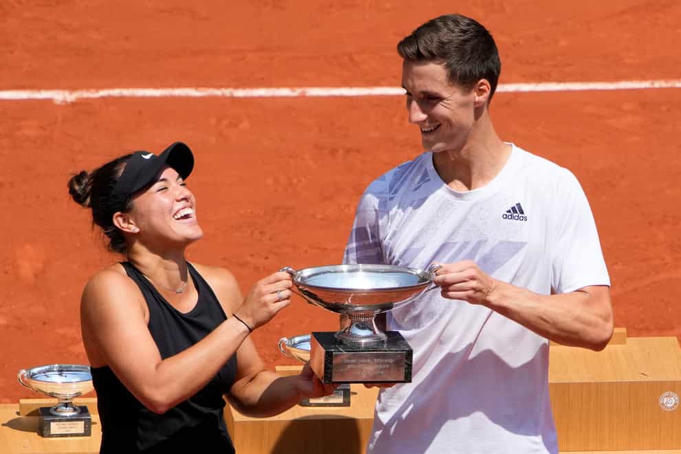 Joe Salisbury, right, and Desirae Krawczyk hold the mixed doubles trophy
