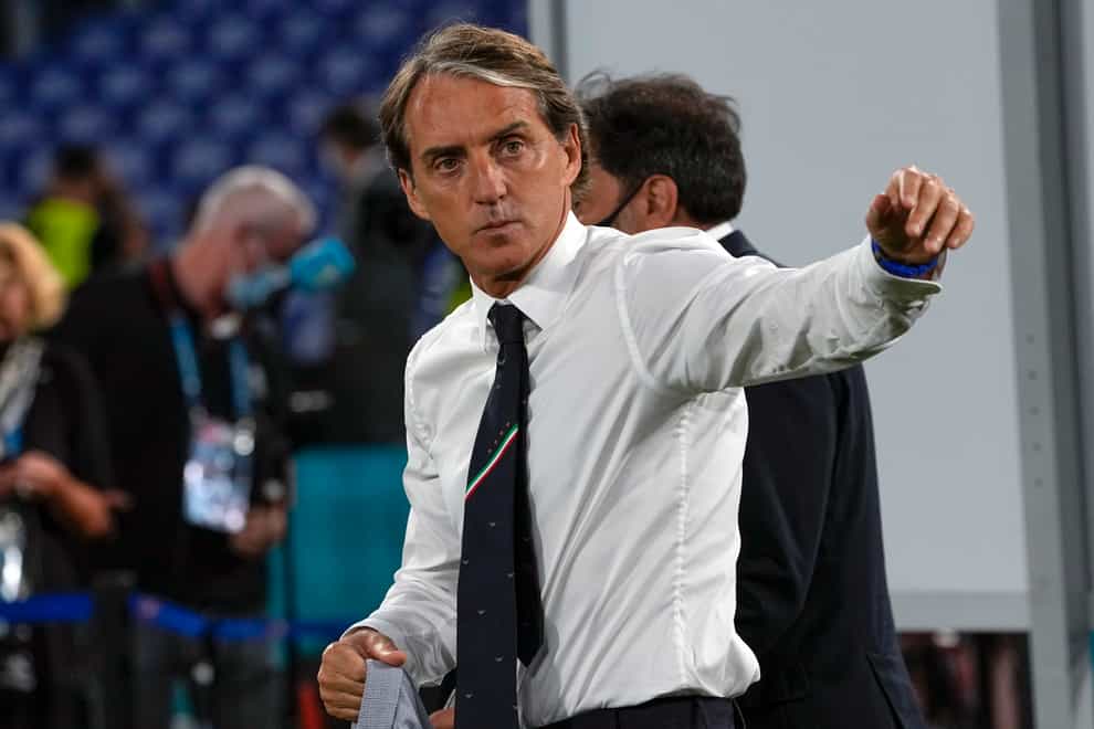 Roberto Mancini walks off the pitch at Euro 2020