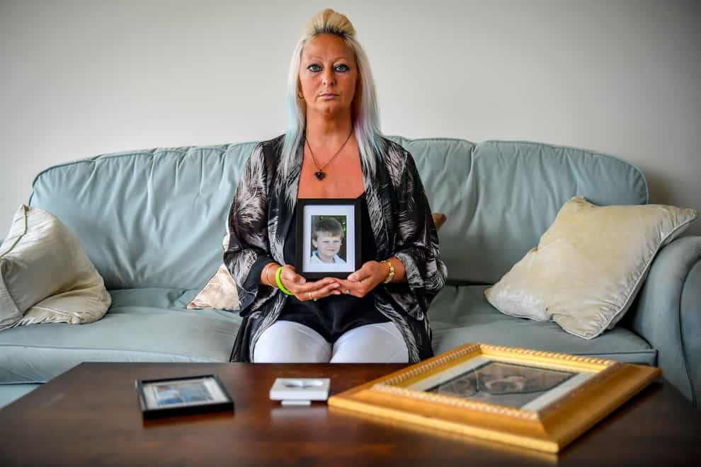 Charlotte Charles holds a photo of her late son Harry