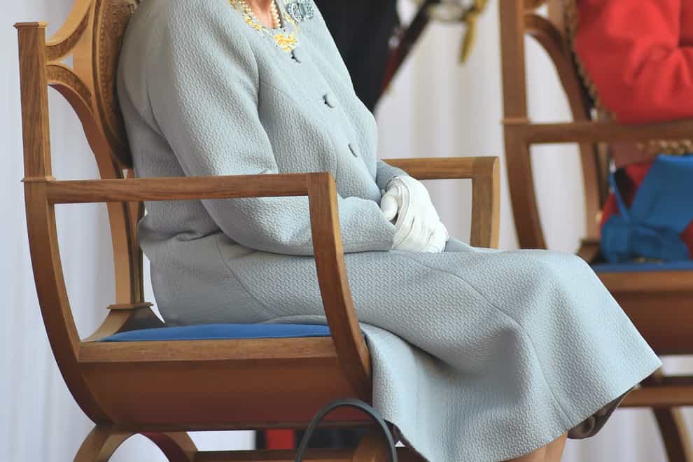 <p>The Queen watches the parade at Windsor Castle</p>