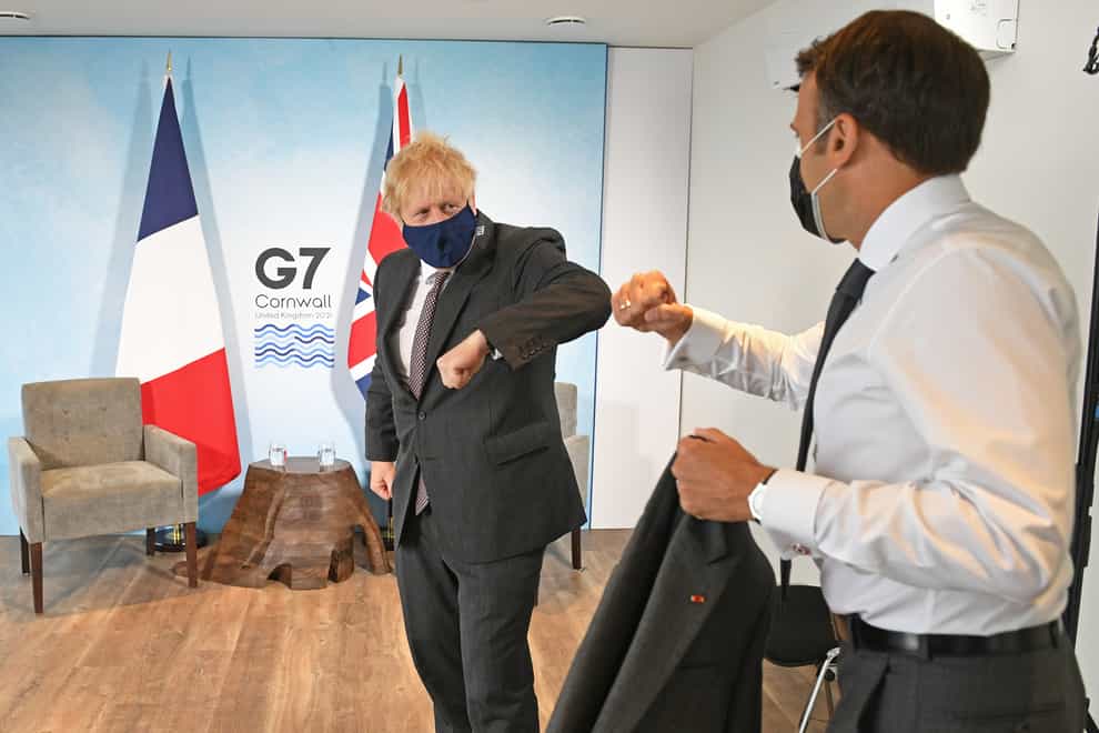 Boris Johnson greets French President Emmanuel Macron at the G7 summit in Cornwall