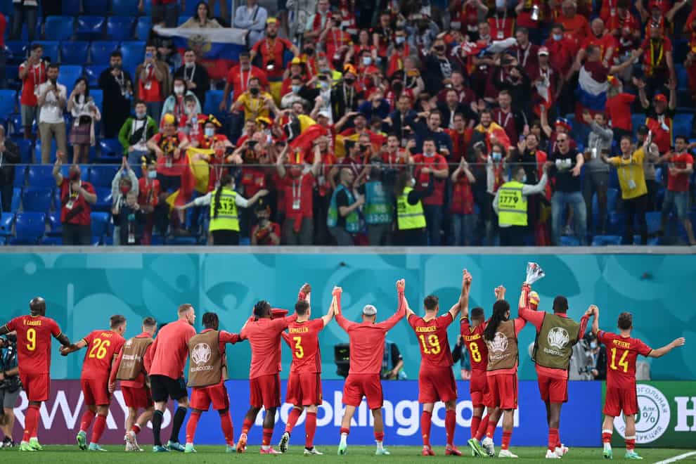 Belgium’s players celebrate with their fans after a 3-0 win over Russia
