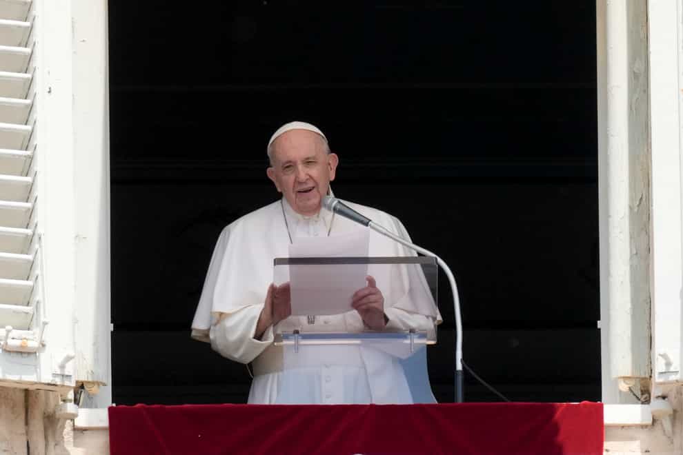 Pope Francis delivers his message during the Angelus noon prayer at the Vatican