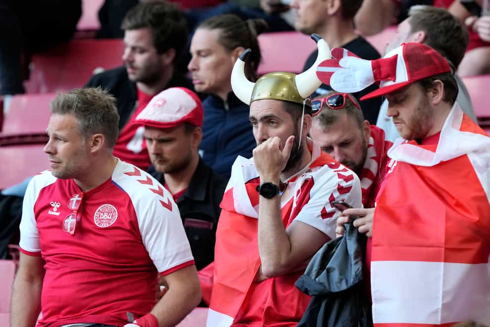 Danish and Finnish fans were left stunned in the stands after Christian Eriksen collapsed on Saturday
