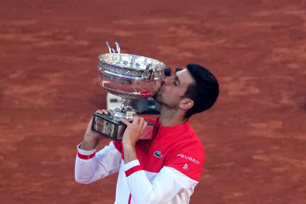 Novak Djokovic kisses the Coupe des Mousquetaires after his victory in Paris