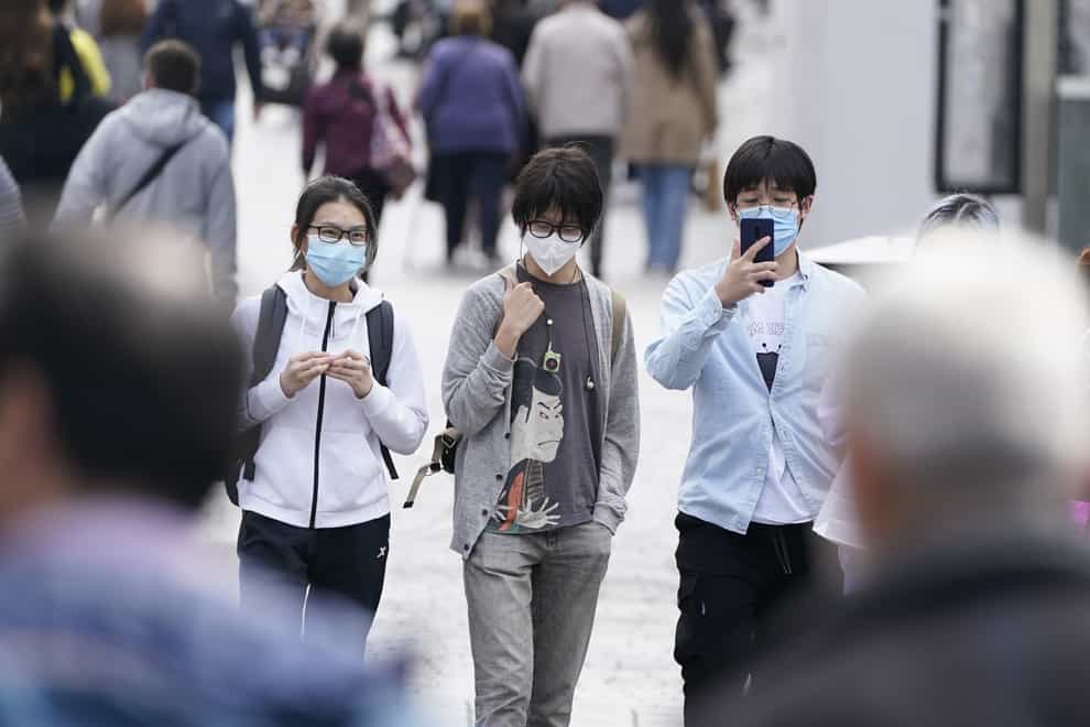 People wearing masks in Liverpool city centre (Peter Byrne/PA)