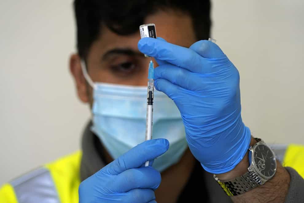 A Covid-19 vaccination is prepared at the Penny Street vaccination centre in Blackburn