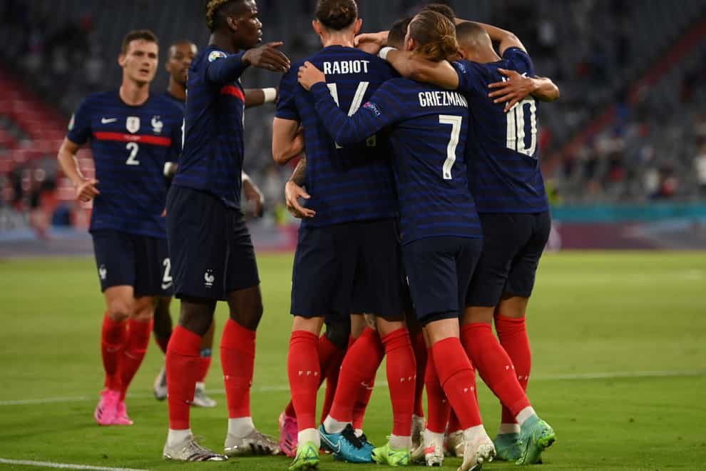 French players celebrate after scoring their side’s first goal during the Euro 2020 Group F match against France and Germany in Munich