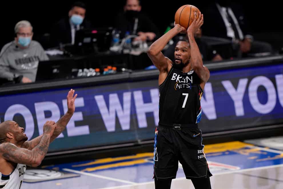 Brooklyn Nets forward Kevin Durant shoots against the Milwaukee Bucks