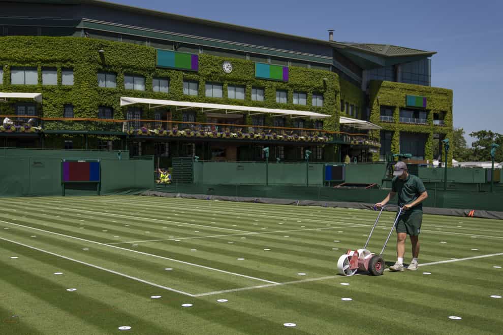 Lines are painted on the outside courts at Wimbledon