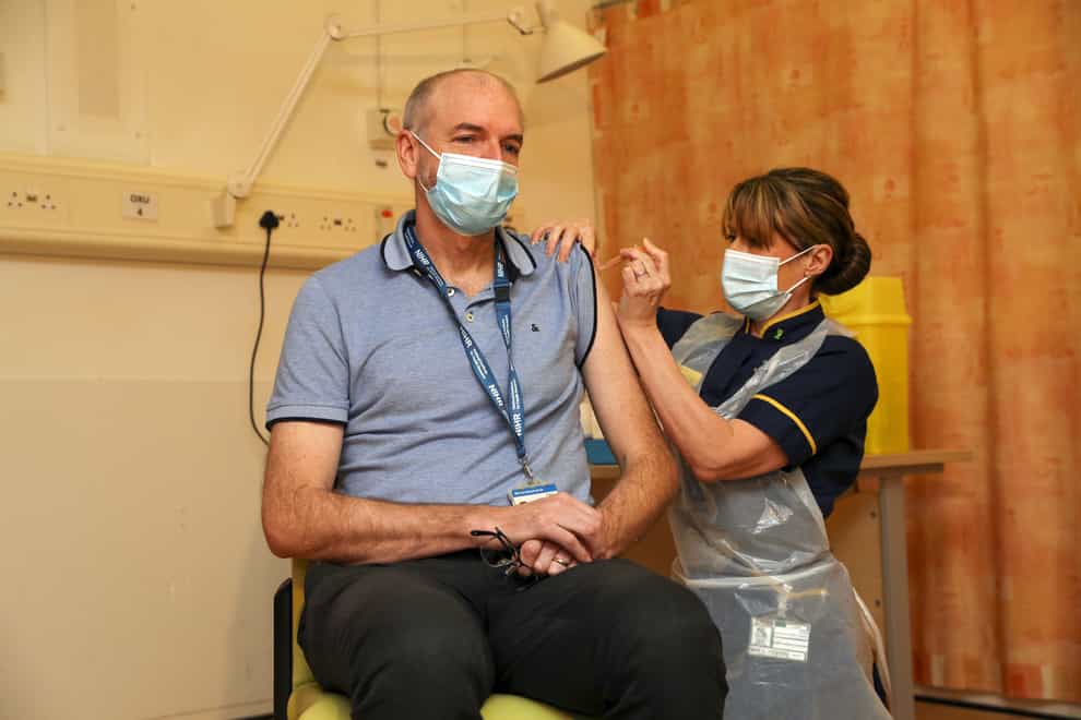 Sir Andrew Pollard receives the vaccine