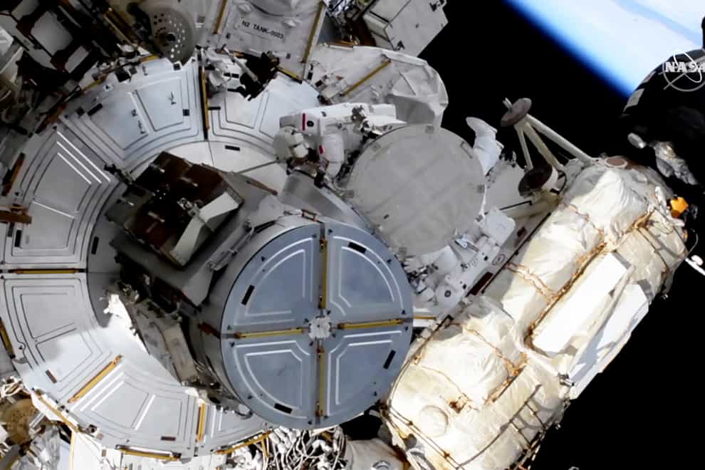 French astronaut Thomas Pesquet, top centre, and Nasa astronaut Shane Kimbrough venture out on a spacewalk