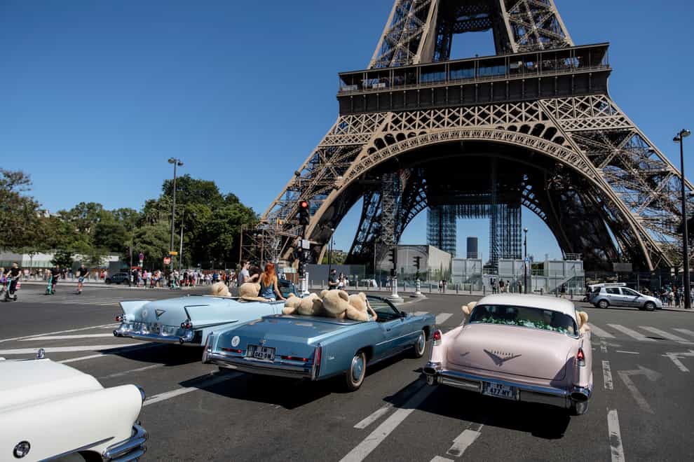 Teddy bears in American vintage cars driven through Paris in a show of support for the Covid-hit tourism industry