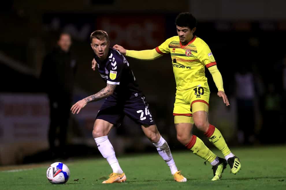 Southend United’s Jason Demetriou (left) and Walsall’s Josh Gordon (right) battle for the ball during the Sky Bet League Two match at Roots Hall, Southend