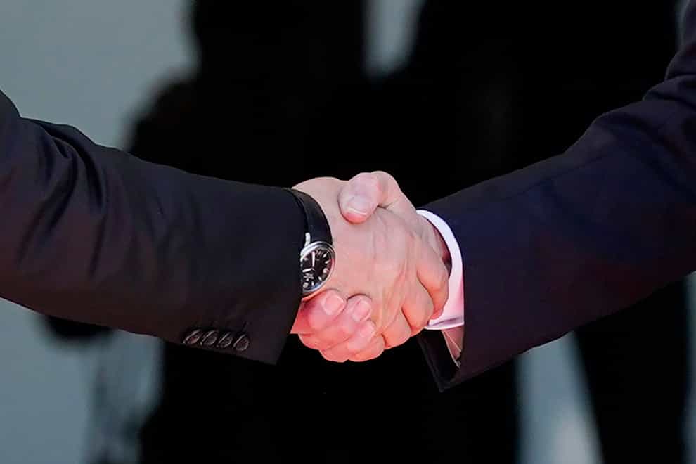 President Joe Biden, right, shakes hands and meets with Russian President Vladimir Putin (Patrick Semansky/AP)