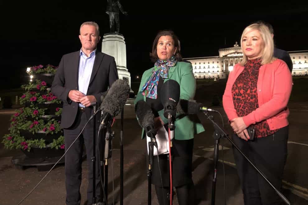 Mary Lou McDonald speaks to reporters outside Stormont in the early hours of Thursday flanked by party colleagues Michelle O'Neill and Conor Murphy