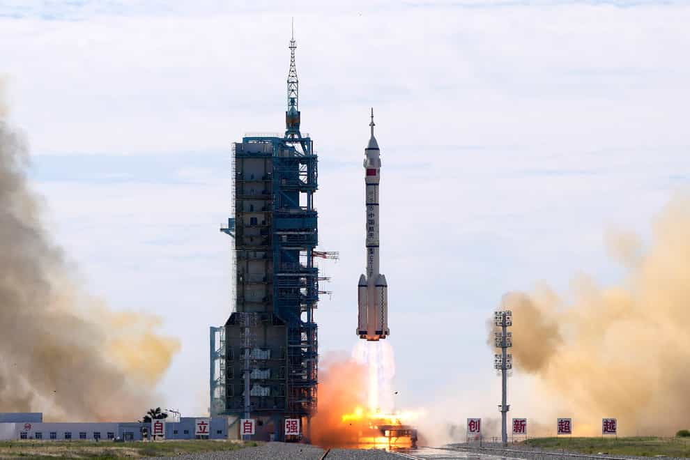 A Long March-2F Y12 rocket carrying a crew of Chinese astronauts in a Shenzhou-12 spaceship lifts off