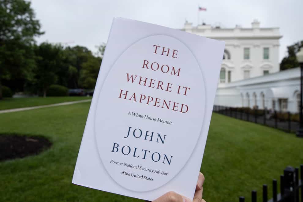 A copy of The Room Where It Happened photographed outside the White House