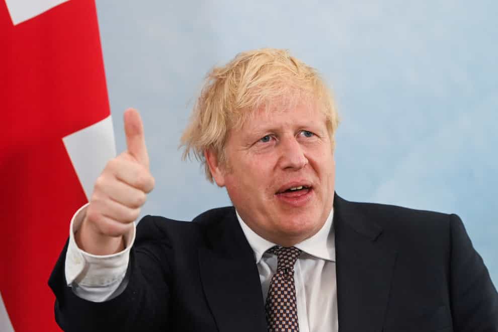 Prime Minister Boris Johnson gives a thumbs up gesture