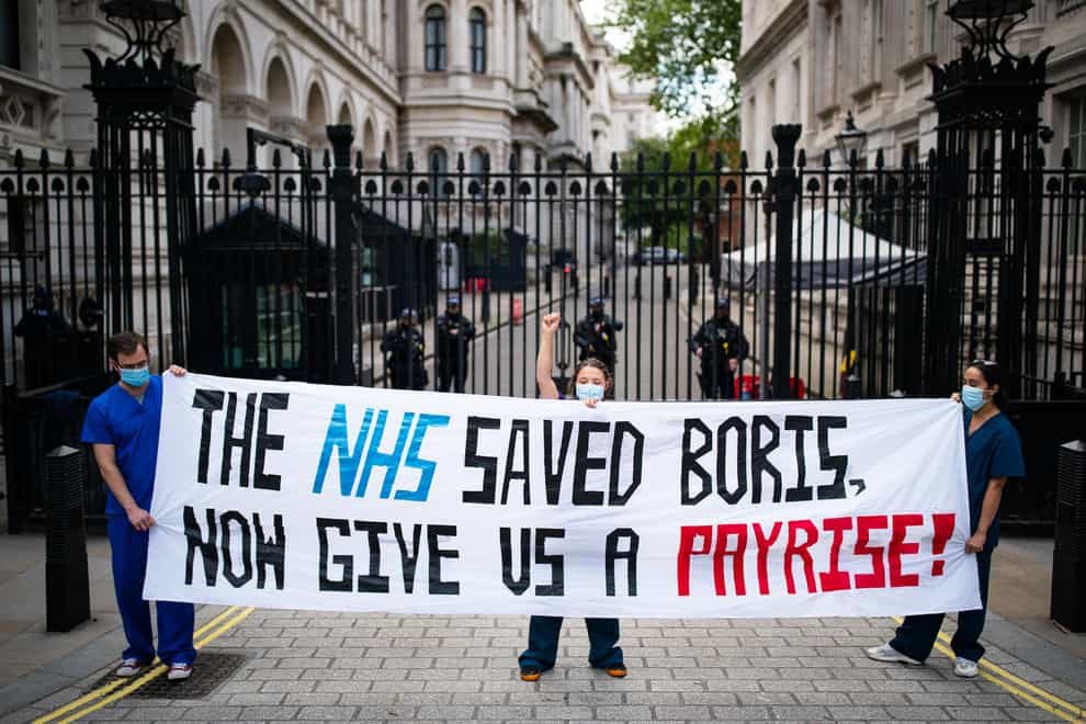 Nurses protesting outside Downing Street last May (Aaron Chown/PA)
