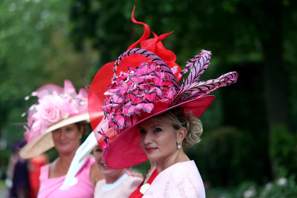 <p>A racegoer arrives ahead of day three of Royal Ascot at Ascot Racecourse</p>