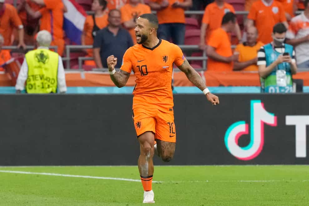 Memphis Depay celebrates scoring for Holland